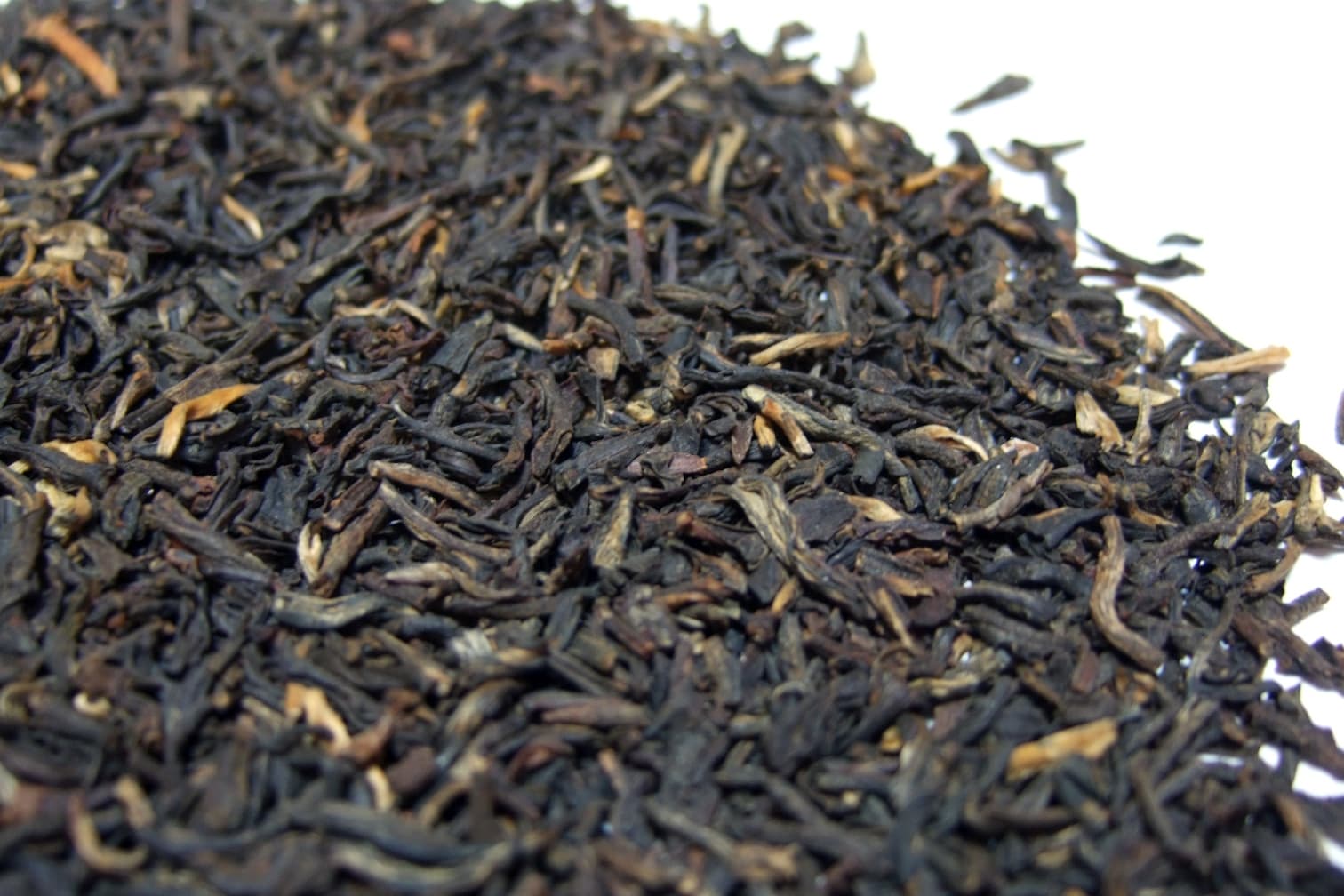 Wiry whole-leaf black tea flecked with golden tips